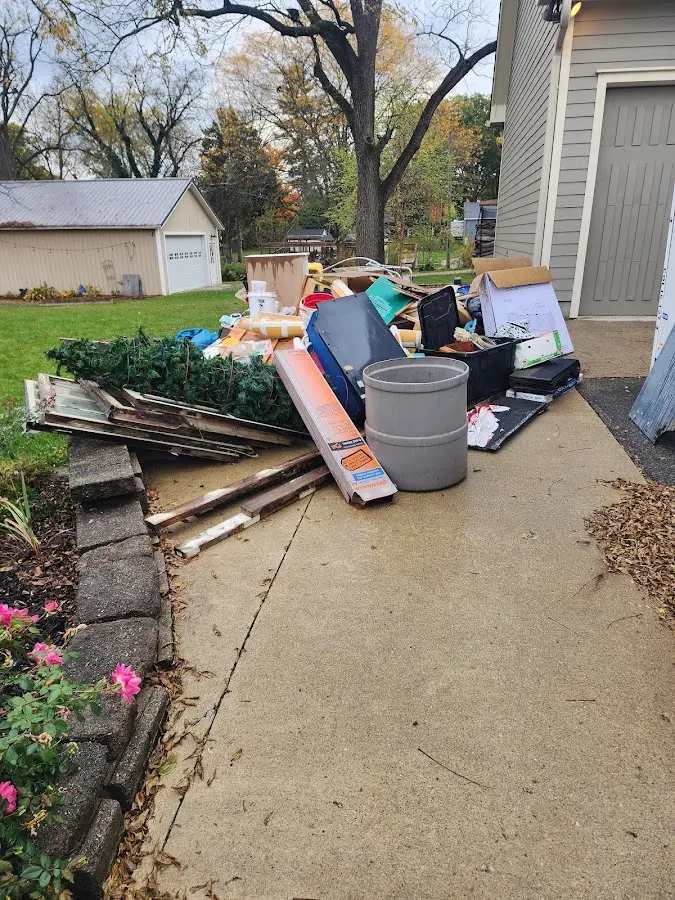 Dumpster being loaded with debris for Demolition Dumpster Rental in Ravenswood
